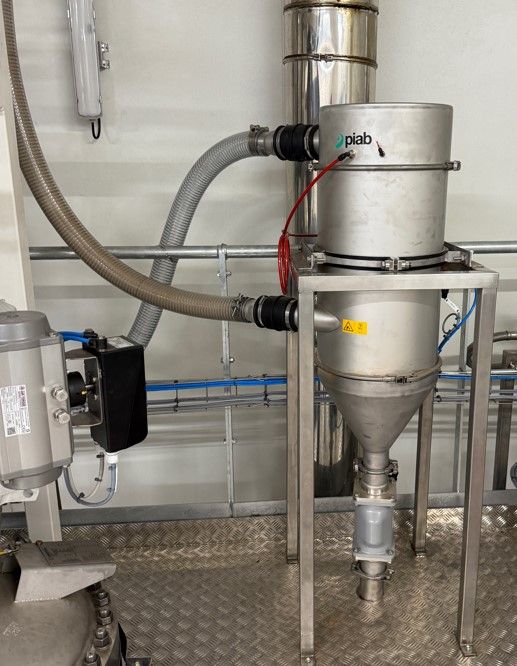 Reprise, transfert sous vide et dosage de fèves de cacao